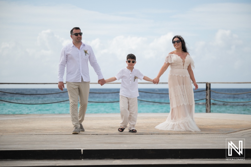 Vow renewal ceremony at Curacao Marriott Beach Resort with family by the beach