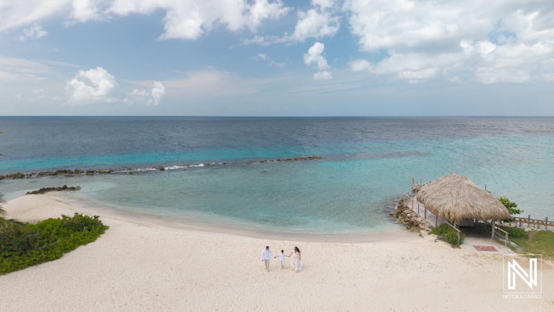 Couple renews vows at Curacao Marriott Beach Resort with ocean view and sandy beach