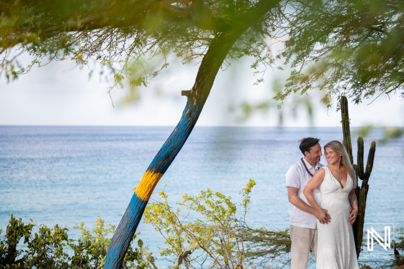 Vow renewal ceremony at Playa Jeremi in Curacao by the ocean with a couple celebrating their love