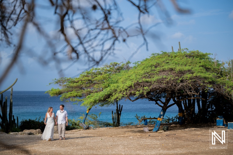 Vow renewal ceremony takes place at Playa Jeremi in Curacao under clear blue skies and warm sunlight