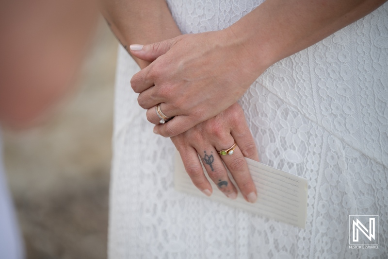 Vow renewal ceremony at Playa Jeremi in Curacao during a special moment with rings and handwritten notes