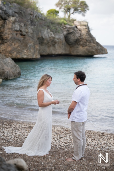 Couple renews vows at Playa Jeremi in Curacao during an outdoor ceremony by the sea