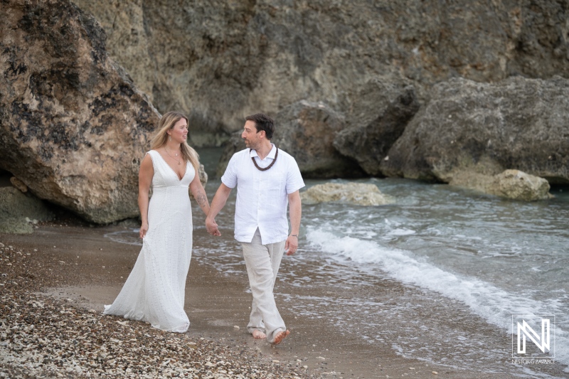 Couple renews vows at Playa Jeremi in Curacao on a beach by the water
