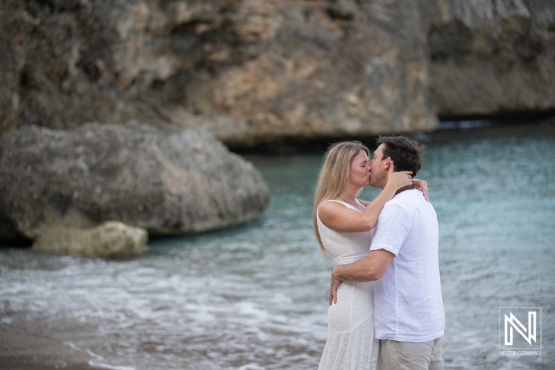 Couple celebrates vow renewal at Playa Jeremi in Curacao by the beach with ocean in the background