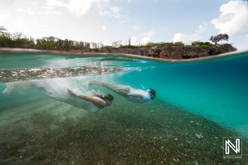 Couple participates in vow renewal ceremony underwater at Playa Jeremi in Curacao
