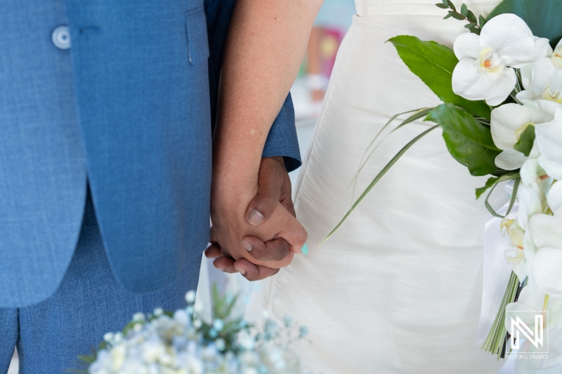 Bride and groom holding hands