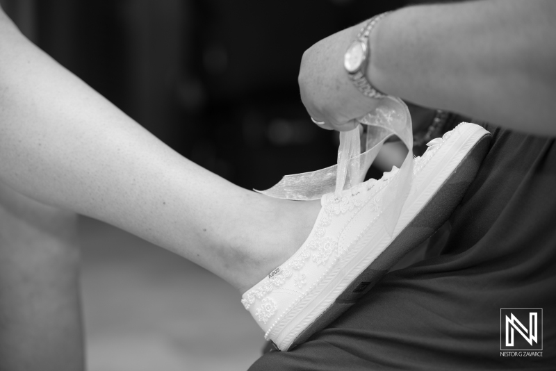 Helping the bride to put on her shoe