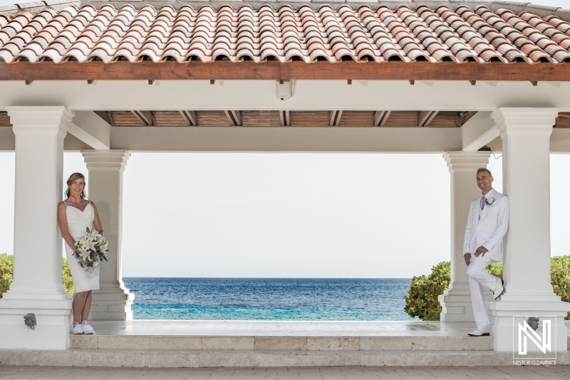 Bride and groom posing in the beach gazebo