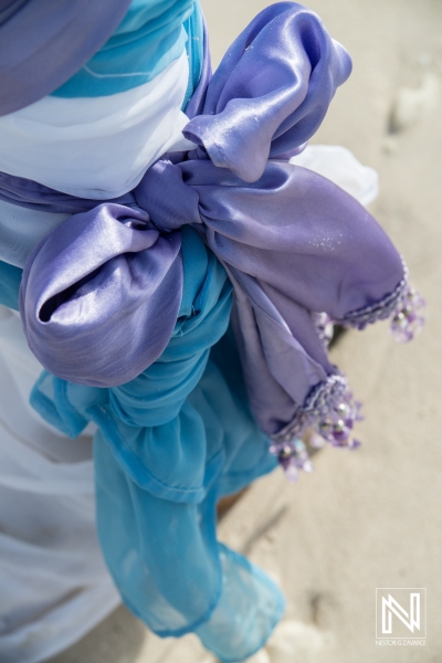 Beach wedding gazebo ribbon decoration with purple and blue