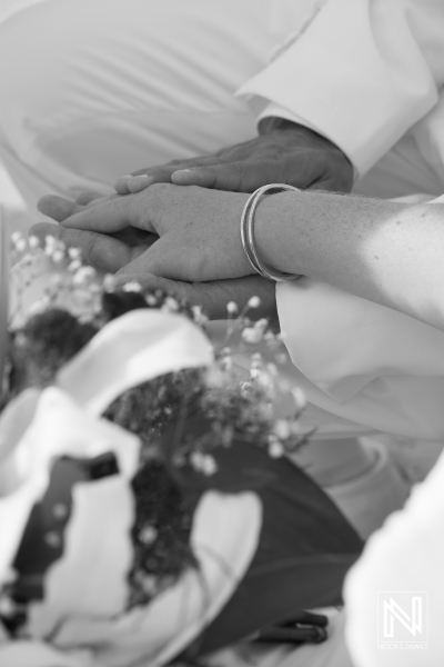 Bride and groom holding their hands together