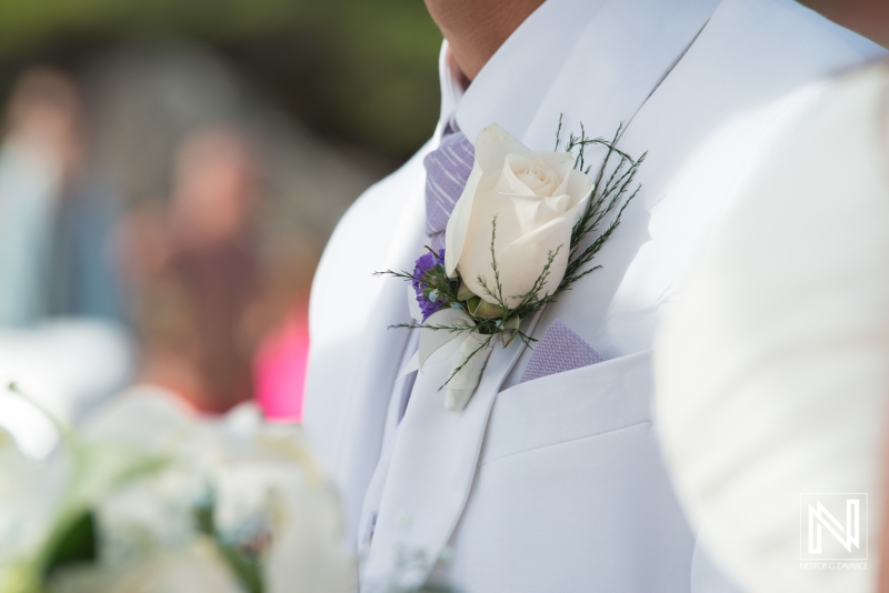 Groom boutonniere with white rose