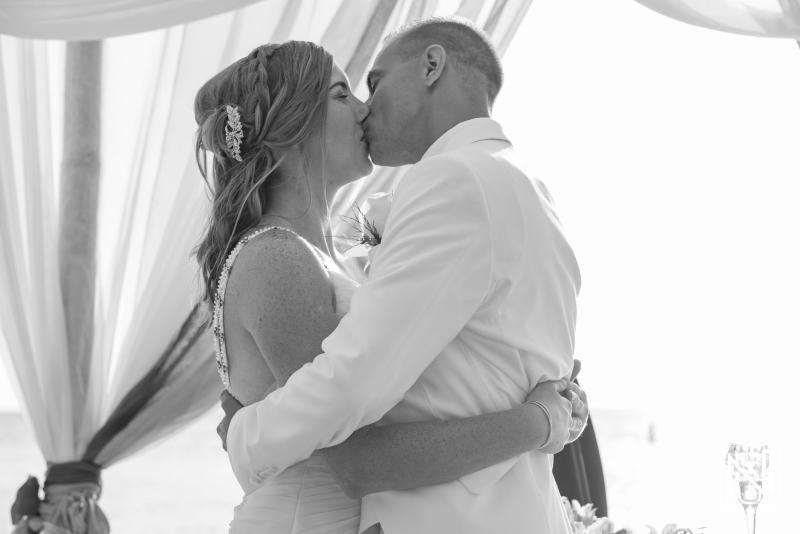 Bride and groom first kiss