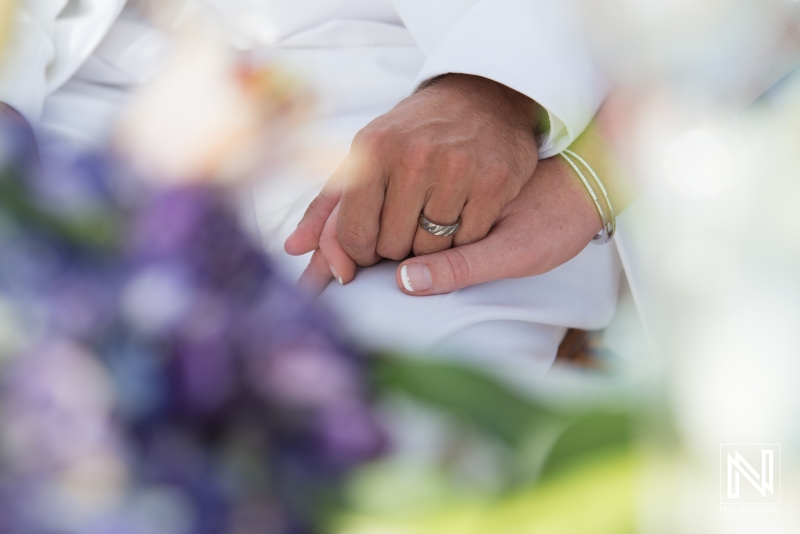 Bride and groom holding their hands together