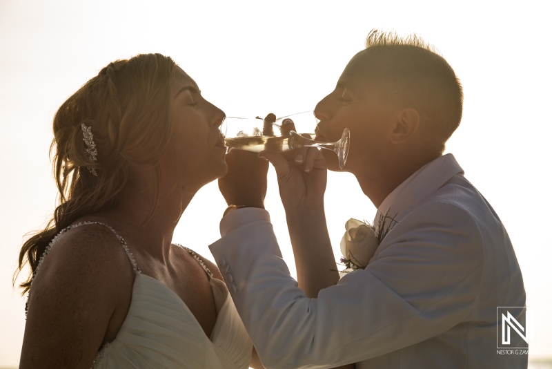Bride and groom toasting with champagne wedding glasses