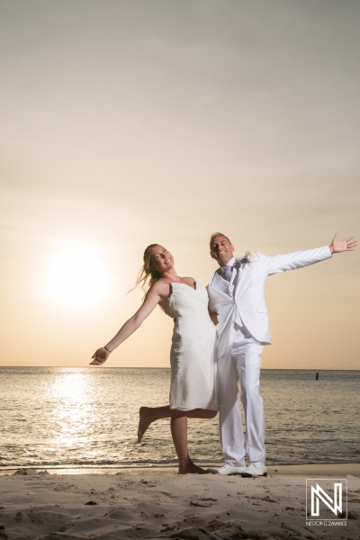 Bride and groom posing in the beach sunset photoshoot