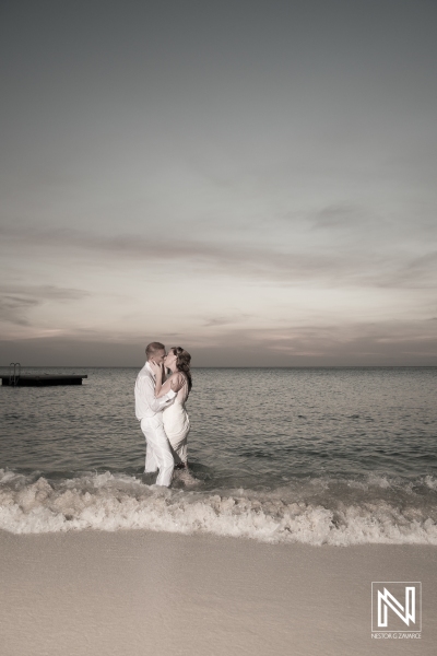 Wedding trash the dress at Kenepa Grandi Beach Curacao bride and groom kissing