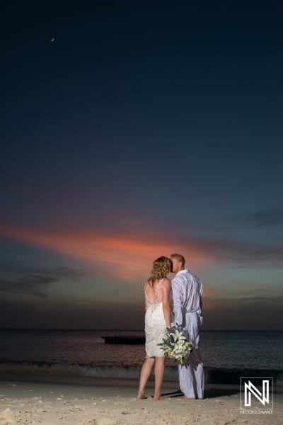 Wedding trash the dress at Kenepa Grandi Beach Curacao bride and groom kissing