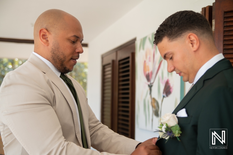 Groom getting into attire