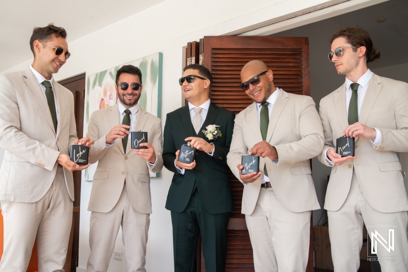 Groom and groomsmen drinking