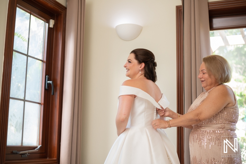 Bride getting into attire