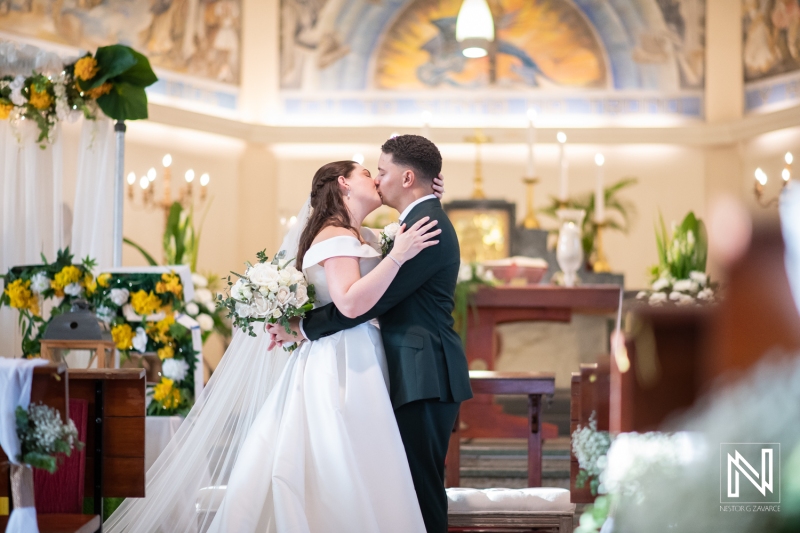 Bride and groom kiss