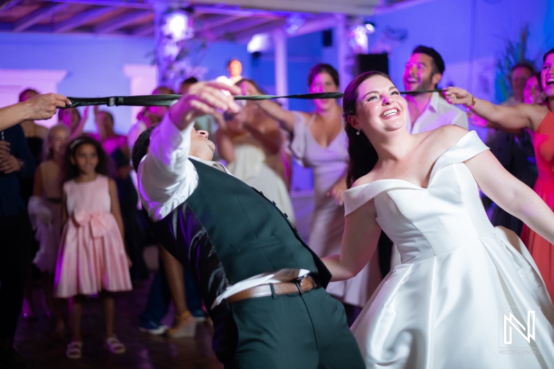 Bride and groom having fun at the reception