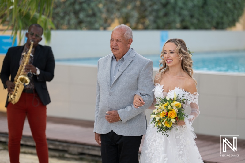 A Joyful Bride Walks Down the Aisle With Her Father, Accompanied by a Saxophonist, at an Outdoor Wedding Near a Pool on a Sunny Day