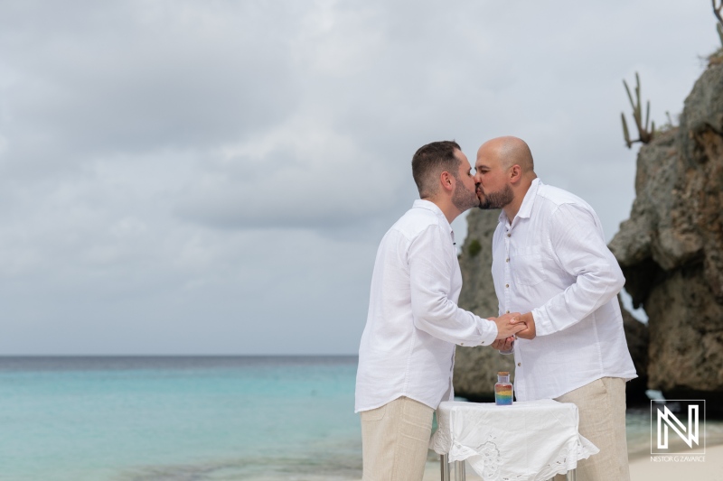 LGBT wedding celebration at sunrise on Cas Abao Beach creates a beautiful moment of love between two grooms in Curacao