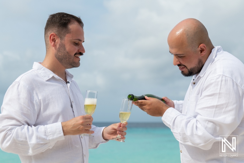 Two grooms celebrate their love at sunrise during a stunning LGBT wedding at Cas Abao Beach in Curacao