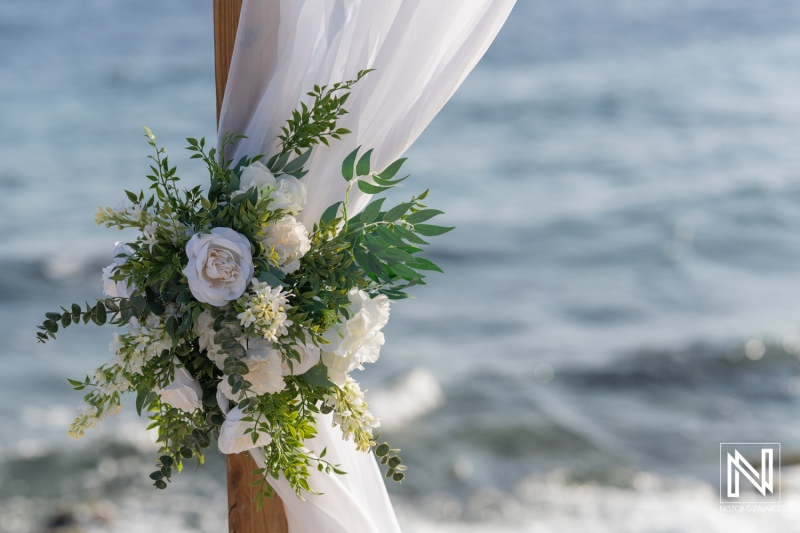 Elegant wedding floral arrangement at Coral Estate Luxury Resort in Curacao with ocean backdrop