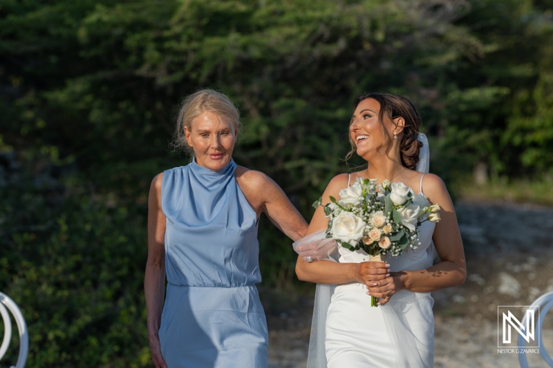 Celebration of love at Coral Estate Luxury Resort in Curacao with a joyful bride and her mother during the wedding ceremony