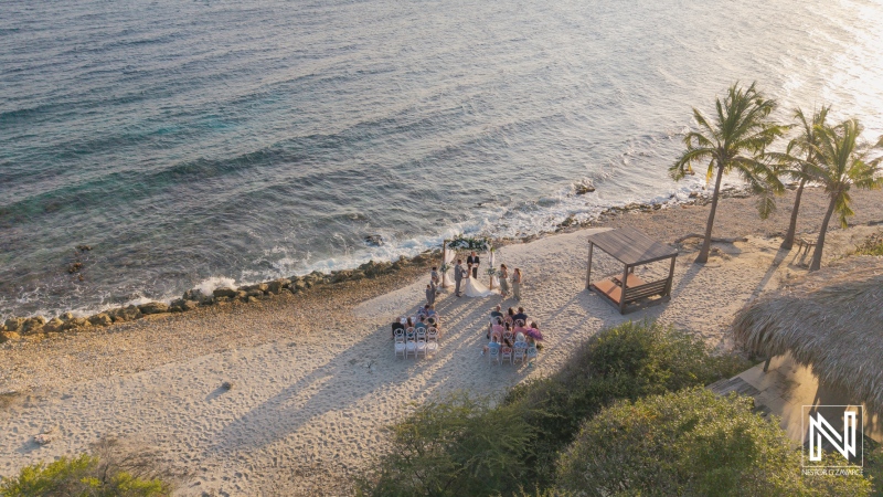 Celebrating love in Curacao at Coral Estate Luxury Resort with a stunning beachside wedding ceremony
