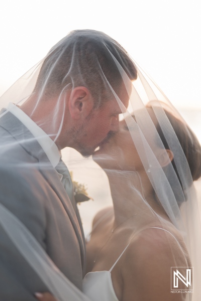 Beautiful wedding moment captured on a romantic evening at Coral Estate Luxury Resort in Curacao, showcasing love and intimacy between the couple