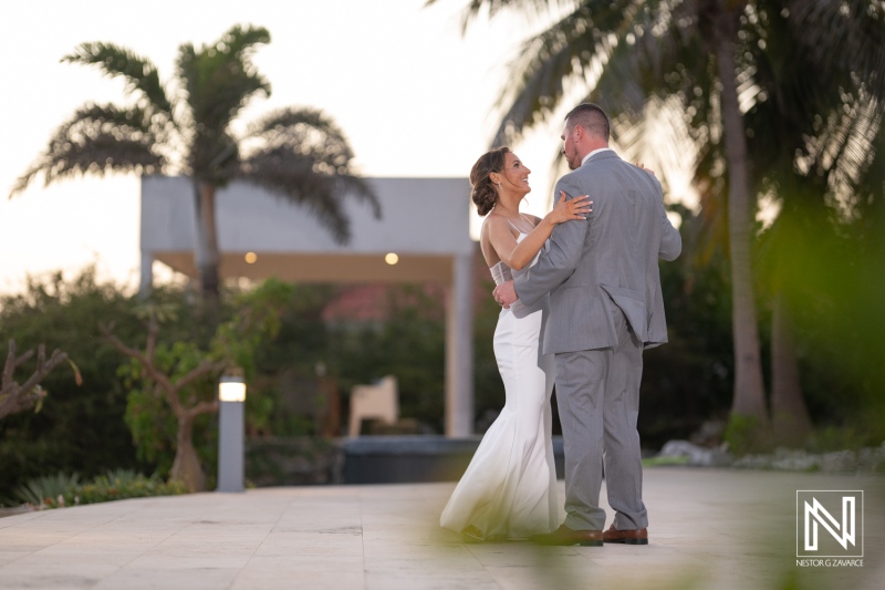 Couple shares a romantic dance at sunset during a wedding celebration at Coral Estate Luxury Resort in Curacao