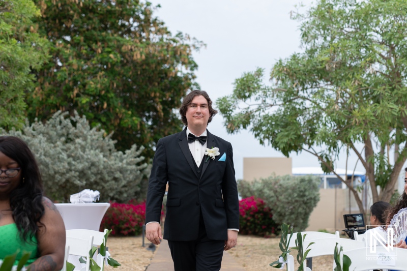 Groom walking down the aisle