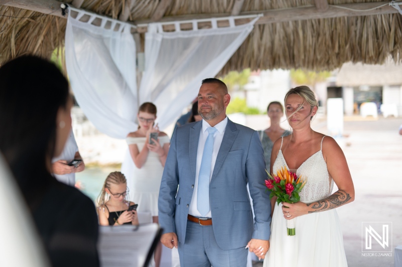 Wedding ceremony at Karakter in Curacao with a beautiful backdrop of sand and sea
