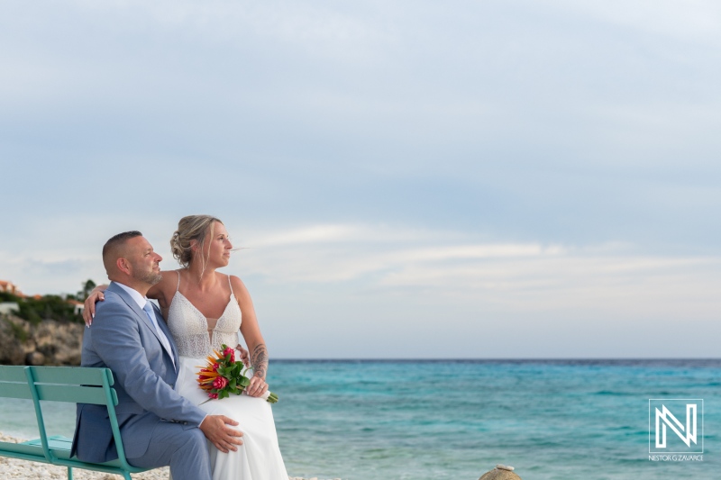 Couple enjoying a romantic moment by the beach in Curacao during their wedding celebration at Karakter