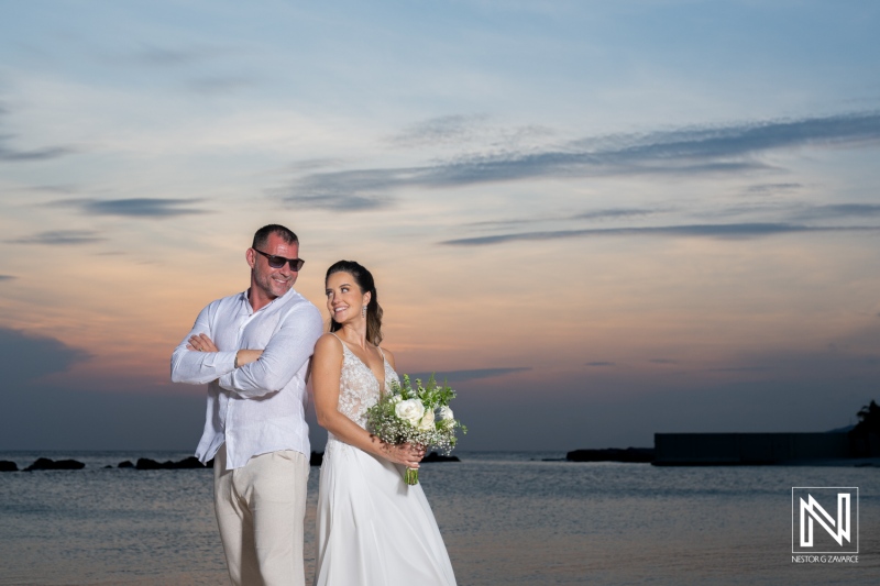 Couple enjoying a romantic sunset on the beach after exchanging vows, celebrating their wedding day in a picturesque coastal location