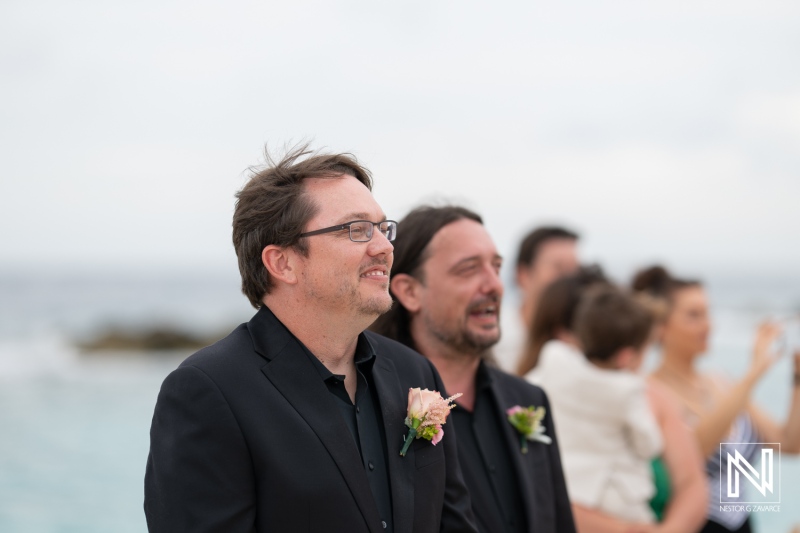 Groom and groomsman at a beach wedding ceremony in Sunscape Curacao