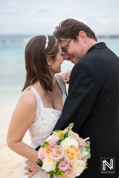 Couple celebrates love during their destination wedding at Sunscape Curacao on a beautiful beach setting