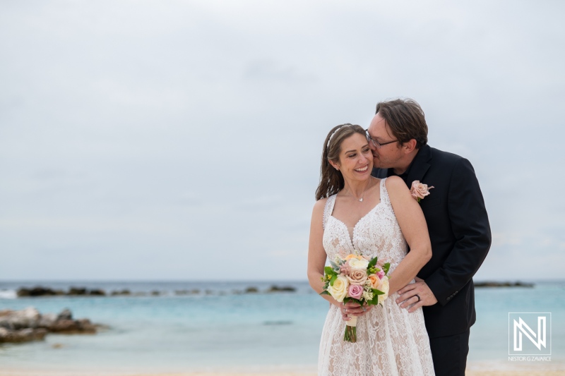 Beautiful couple celebrates their destination wedding on the beach in Sunscape Curacao