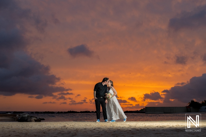 Beautiful sunset wedding ceremony at Sunscape Curacao featuring a loving couple