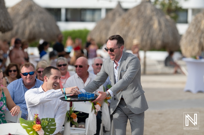 Ceremony at Rif at Mangrove Beach Corendon in Curacao with guests enjoying a picturesque wedding day