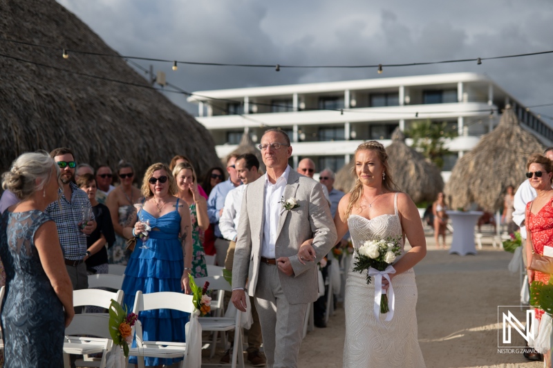 Beautiful wedding ceremony at Mangrove Beach in Curacao surrounded by loved ones and a stunning ocean backdrop