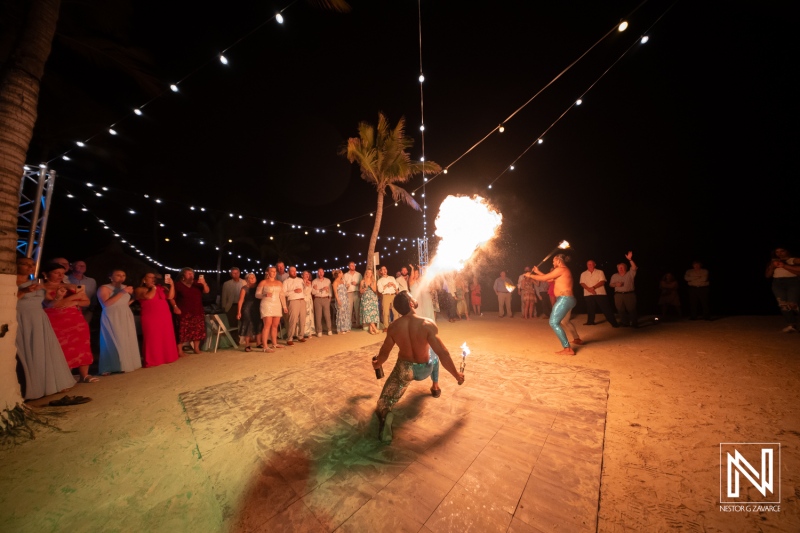 Stunning fire dance performance at a wedding celebration in Curacao's Rif at Mangrove Beach Corendon