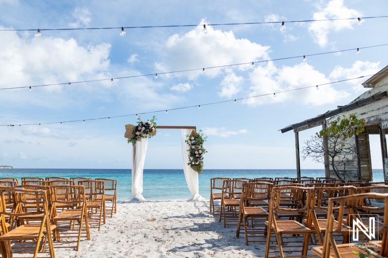 Wedding setup at Playa Hunku in Curacao with chairs and decorations on the beach