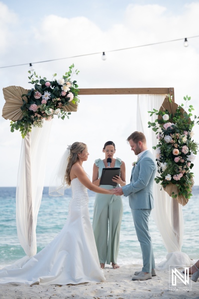 Wedding ceremony at Playa Hunku in Curacao with couple and officiant by the beach