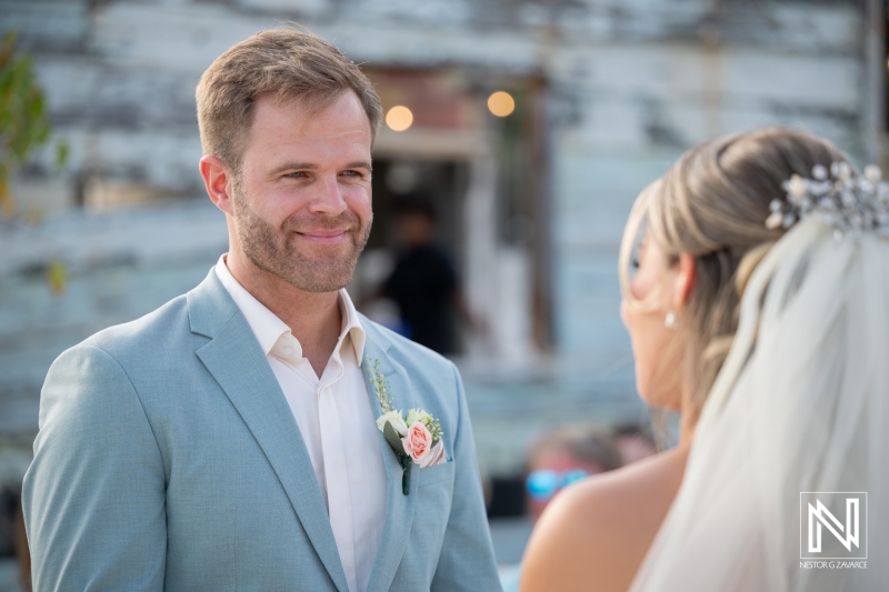 Couple exchanges vows at Playa Hunku wedding in Curacao during warm afternoon