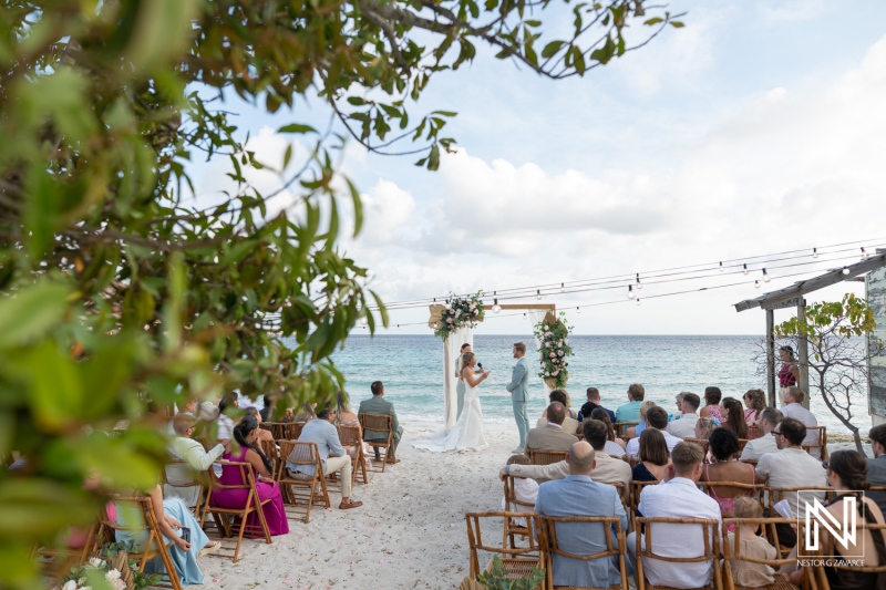 Wedding ceremony at Playa Hunku in Curacao with guests seated on the beach