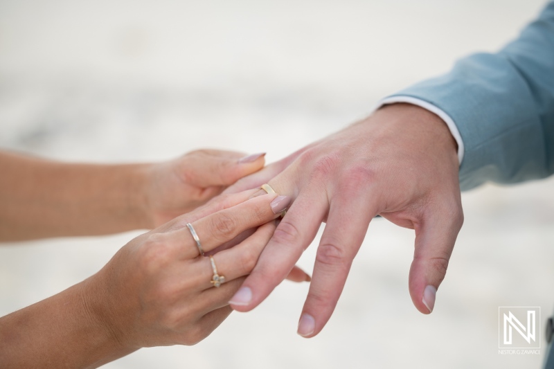 Couple exchanges wedding rings during ceremony at Playa Hunku in Curacao